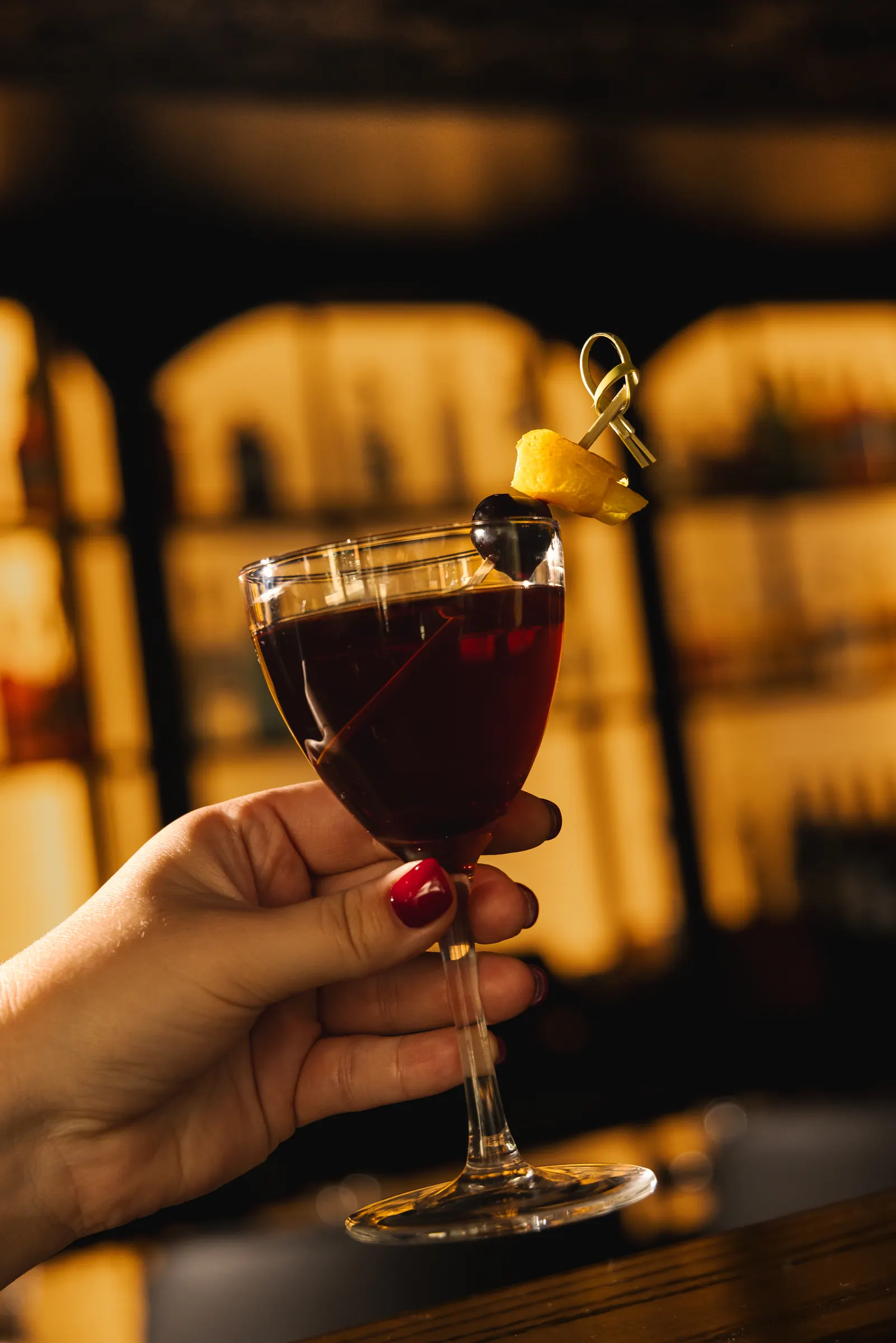 Red vermouth cocktail in a Nick and Nora glass